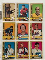 Front view of nine 1972-73 O-Pee-Chee hockey cards showing players from various NHL teams.