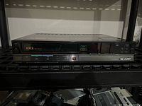 Front view of Sharp VC-685U VCR with buttons and tape slot visible