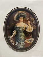 Oval metal serving tray featuring a Victorian-era woman holding a Pepsi beverage, with Pepsi Cola logo and bar background.