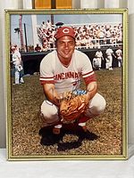 Framed color photograph of Johnny Bench in Cincinnati Reds uniform with autograph on front.
