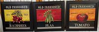 Three framed prints of Old Fashioned radishes, peas, and tomato side by side.