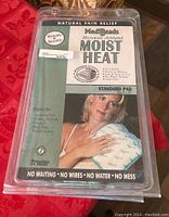 Two MediBeads heating pads in original packaging showing front label with usage and benefits information