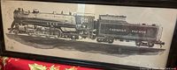 Side view of a framed black and white print featuring a detailed Canadian Pacific steam locomotive and tender, housed in a black frame with visible hanger.