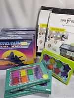 Top Gun board games, Colorageous bear shaped glitter crayons, star shaped crayons, and Paper Riot wall decal packages