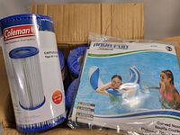 One Coleman Type III pool filter cartridge in original packaging alongside an Aqua Fun curved pool noodle in sealed packaging with an image of two children in a swimming pool.
