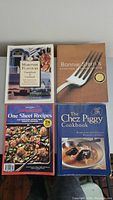 Four cookbooks arranged in a 2x2 grid including Maritime Flavours, Bonnie Stern's Essentials of Home Cooking, The Best of Pennsylvania Dutch One Sheet Recipes, and The Chez Piggy Cookbook.