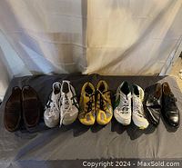 Front view of all six shoes displayed side-by-side showing dress and athletic styles in various colors and sizes