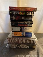 Stack of 12 Stephen King books showing various titles and conditions