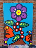 Full frontal shot of painting against brick wall