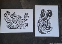Photo of two original acrylic paintings by Don Chase showing abstract monochrome designs on white acid-free art paper. Both signed and titled 'Warm'.