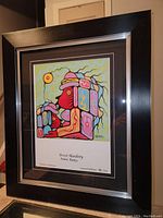 Framed fine art print by Brent Hardisty titled "Mothers Embrace," showing the full framed artwork with visible details and signature/numbering at bottom.