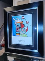 Frontal photo of professionally framed colorful Native American style fine art print showing clear detail of artwork, signature, and limited edition numbering.