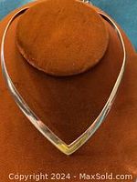 Front view of sterling silver V shaped necklace choker displayed on brown velvet stand