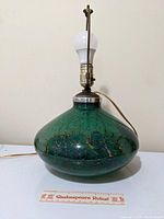 Lamp base with socket, working bulb and six-inch ruler at front