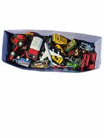 Top view of all the assorted die cast vehicles in a box, showing various colors and sizes including cars, trucks, and vans.