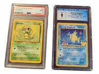 Image showing two graded Pokémon cards: a 1999 Caterpie card graded PSA 9 and a 2021 Celebrations Shining Magikarp card graded CGC 9.
