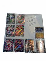 Binder page with nine holo Japanese Pokemon cards and handwritten note listing total cards and highlights