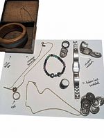 Full lot showing all jewelry items including the wood bangles, rings, necklaces, beaded bracelet, watch, and buttons/pins on white background with seller notations.