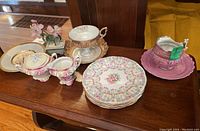 Overview of all items including plates, cream and sugar bowl, cups and saucers.