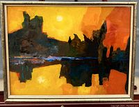 Full front view of abstract landscape painting in gold-tone frame on easel