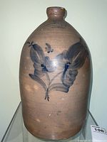 Frontal view of full jug showing overall shape and floral decoration