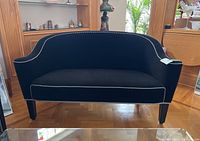 Front view showing curved back and seat.