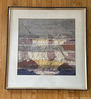 Full view of framed and matted watercolour painting on hardwood floor