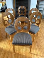 Front view of all six chairs arranged in a semi-circle