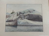 Unframed sheet showing full watercolour of pale granite rock formation at water’s edge.