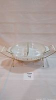 Full view of the Pyrex divided dish set in warming stand with lid showing gold star design and metal handles.