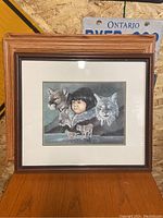 Framed print showing full artwork with child and animal portraits.