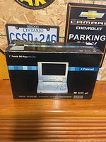 Box of Polaroid PDV-0700 portable DVD player showing branding and model