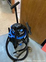 Full view of Mastervac wet/dry vacuum cleaner with hose and attachments showing overall appearance and condition