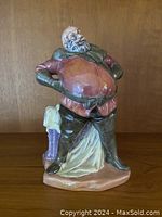 Front view of Royal Doulton Falstaff figurine showing character stance and colors.