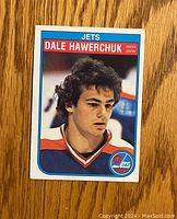 Front of vintage 1982-83 O-Pee-Chee Dale Hawerchuk rookie hockey card showing player portrait in Jets jersey.