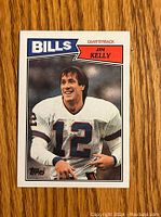Front image of 1987 Topps Jim Kelly rookie card showing player in Bills uniform