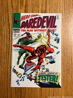 Front cover of Daredevil issue #42 showing Daredevil fighting the Jester and the comic title.