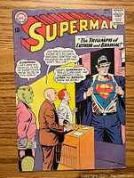 Front cover of Superman #173 comic showing Superman revealing his S emblem and background characters.