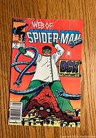 Front cover of Web of Spider-Man #5 comic book showing Spider-Man and Doctor Octopus.