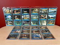 Front view of all 30 James Bond Moonraker collector cards showing images from the 1979 film arranged on a display stand.