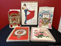 Front view of five vintage Valentine cards showing pop-up, fold-out and flat card designs