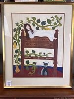Front view of the framed tempera painting showing a reclining woman on a bed with green vines and a cat beneath.