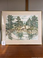 Full view of framed watercolour painting showing composition of trees, rocks and reflection