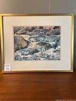 Frontal view of framed painting showing the image, mat, golden frame and auction lot sticker