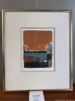 Framed watercolor painting with gold-tone metal frame and white mat, full front view