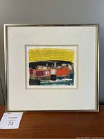 Frontal view of framed abstract watercolour painting on tabletop with lot tag