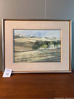 Full view of framed watercolour landscape painting.