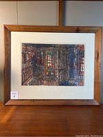 Full view of framed artwork showing interior scene and wooden frame with scratches.