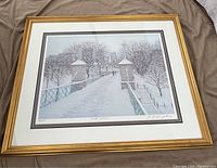 Full view of the framed "Winter Sentinels Boston Public Gardens" print by E. Joseph Fontaine showing the scene of a snowy park entryway with trees, stairs and lamp post.