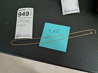 Full view of the gold chain necklace laid out long with a note stating '585'